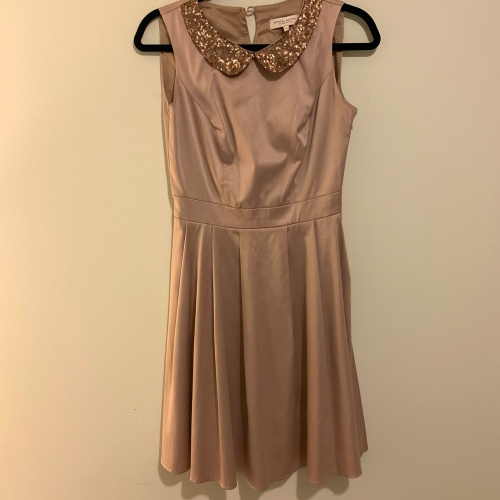 Satin sand colored skater dress with sequin collar